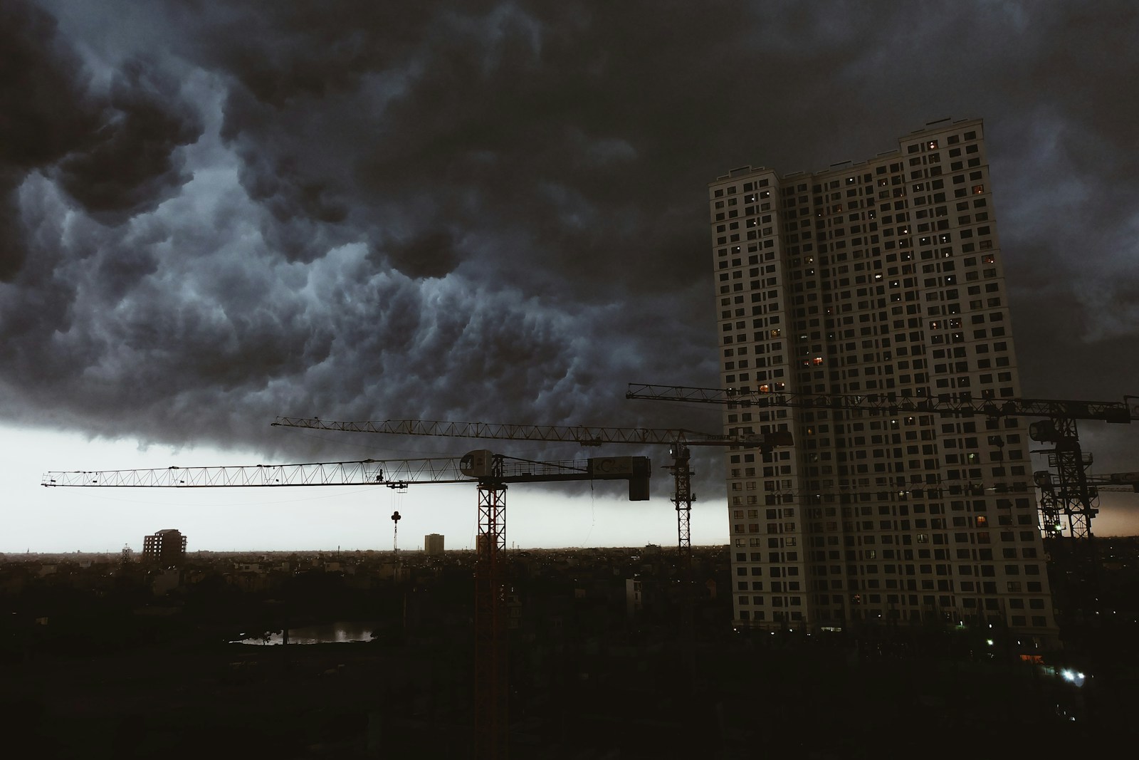 a very tall building under a cloudy sky